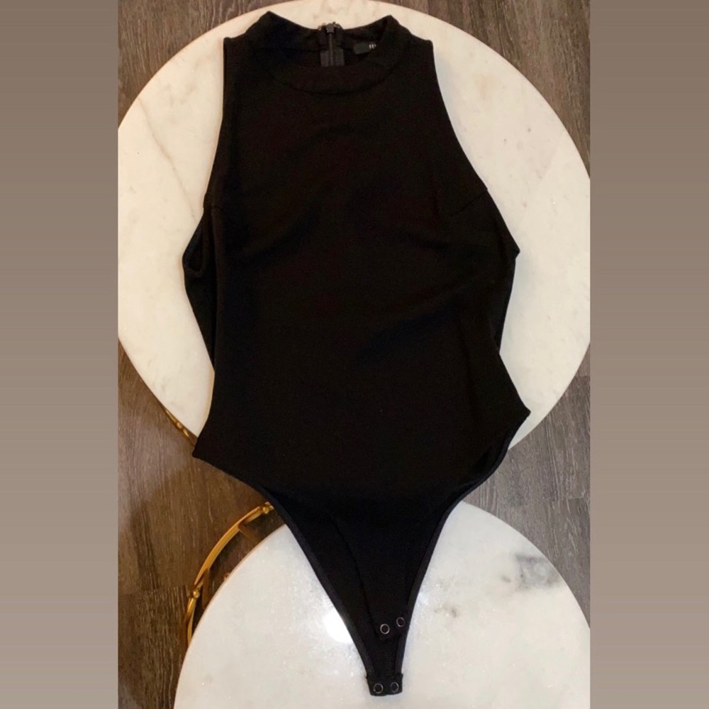 Sleeveless turtleneck bodysuit